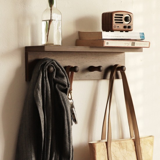 Toilet room wall-mounted storage rack
