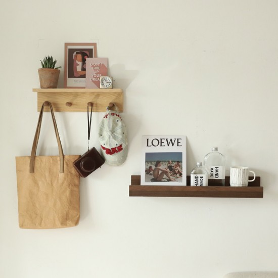 Toilet room wall-mounted storage rack