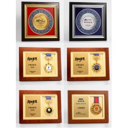 Custom-made medals, metal and wooden authorized dealer plaques, honor certificates, retirement and military discharge memorabilia